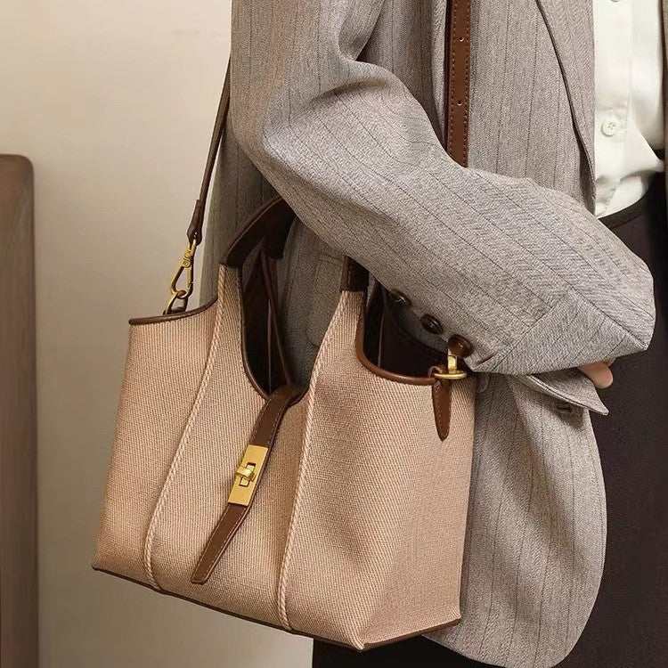 PU leather crossbody handbag in elegant black, seen from side to show slim, structured silhouette