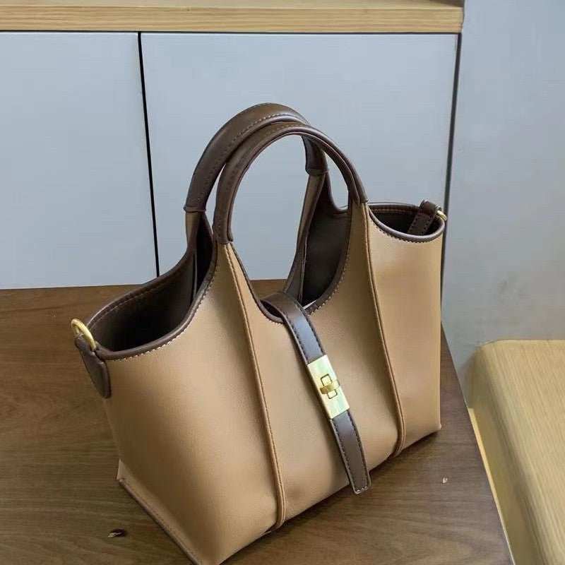 High-end women’s crossbody bag with minimalist urban style, rear panel view showcasing durable stitching