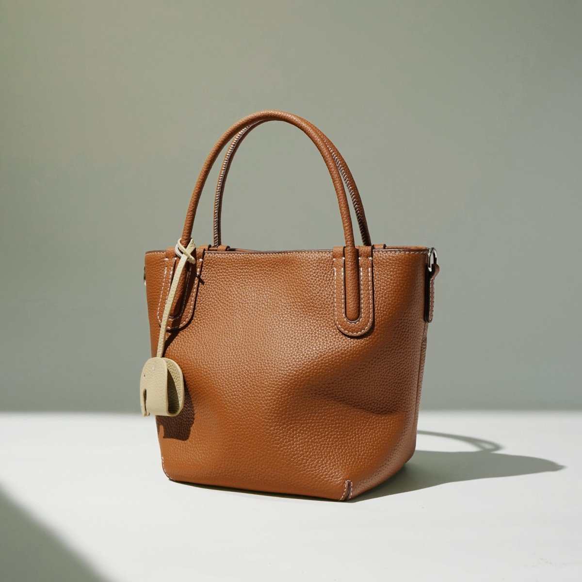 Chic Leather Handheld Crossbody Bag in genuine cowhide leather with bucket silhouette front view