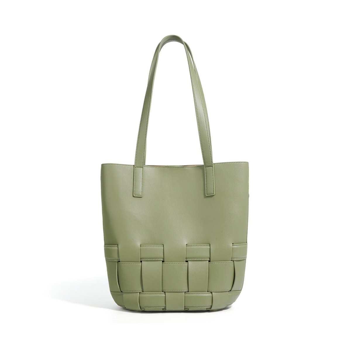 Genuine cowhide tote showing woven pattern, sturdy handles, and classic rectangular bag shape