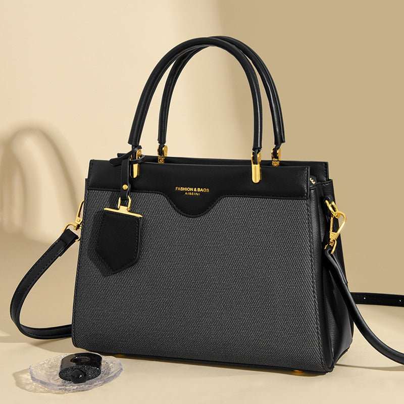 High-end messenger bag open to show organized interior compartments for phone and wallet