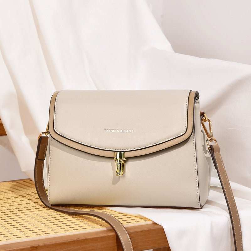 Wide strap soft leather tote bag for women shown with contents, demonstrating XL capacity