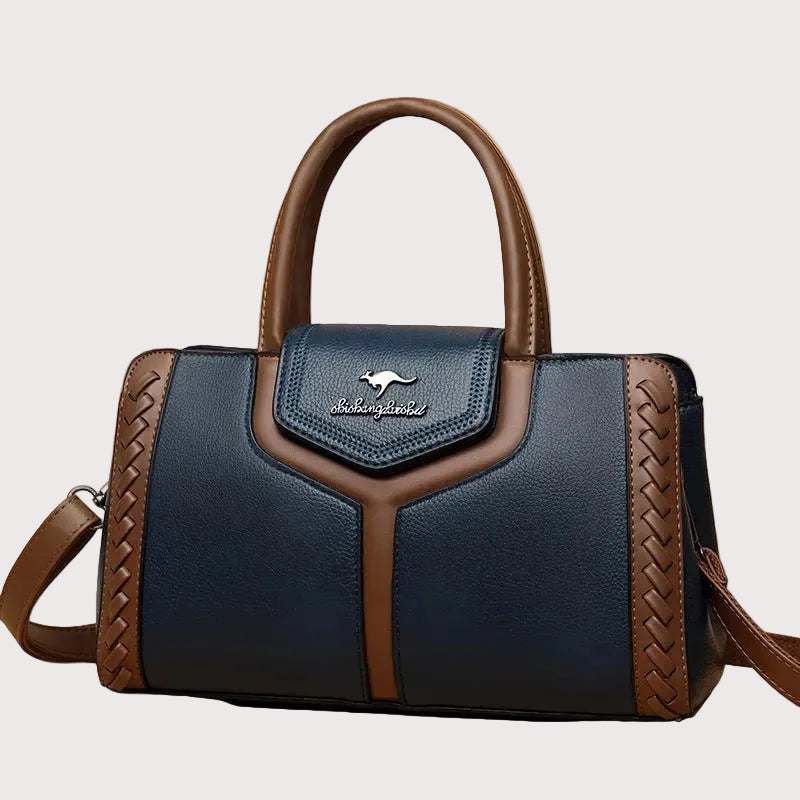 Large-capacity crossbody bag in vegan leather with adjustable strap and organized pockets, front view