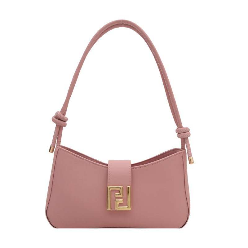 Versatile women’s handbag in black synthetic leather, adjustable strap and secure zipper closure displayed