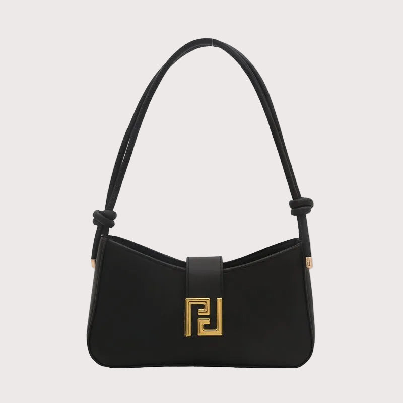 Structured women’s handbag in black PU leather with shoulder strap, elegant shape, and gold hardware