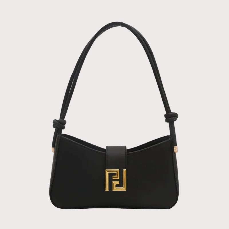 Structured women’s handbag in black PU leather with shoulder strap, elegant shape, and gold hardware