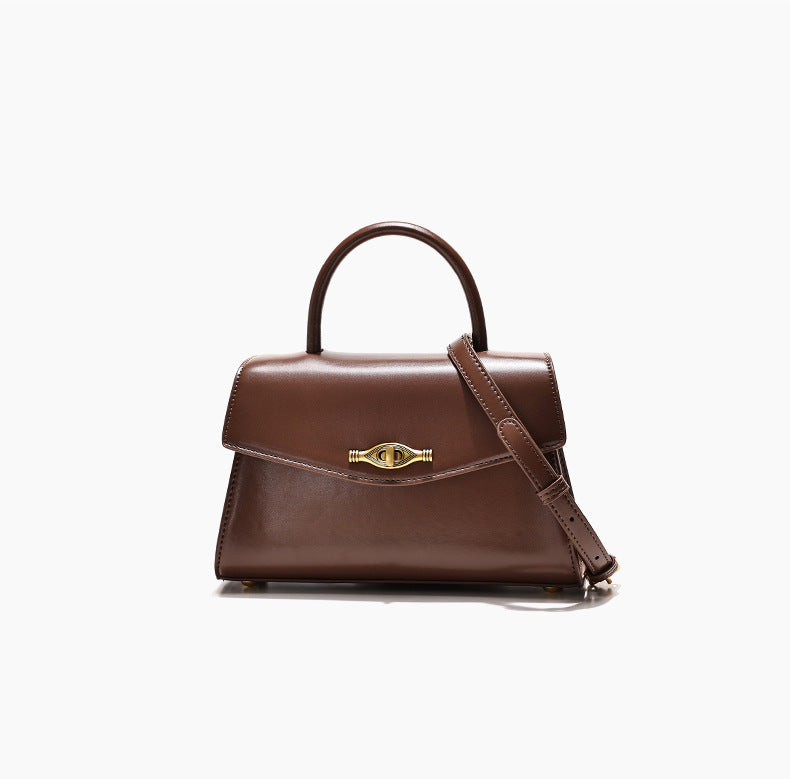 Vintage Metal Buckle brown synthetic leather handbag with structured shape, top handle, and adjustable crossbody strap