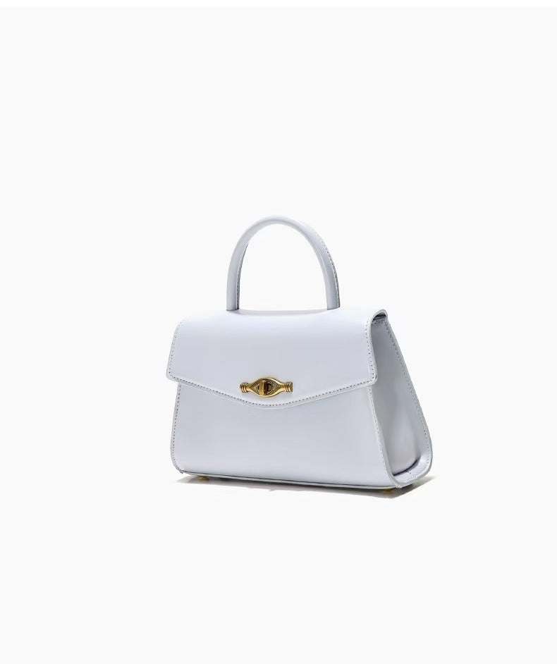 Vintage Metal Buckle handbag in white synthetic leather with structured shape, top handle, and flap closure