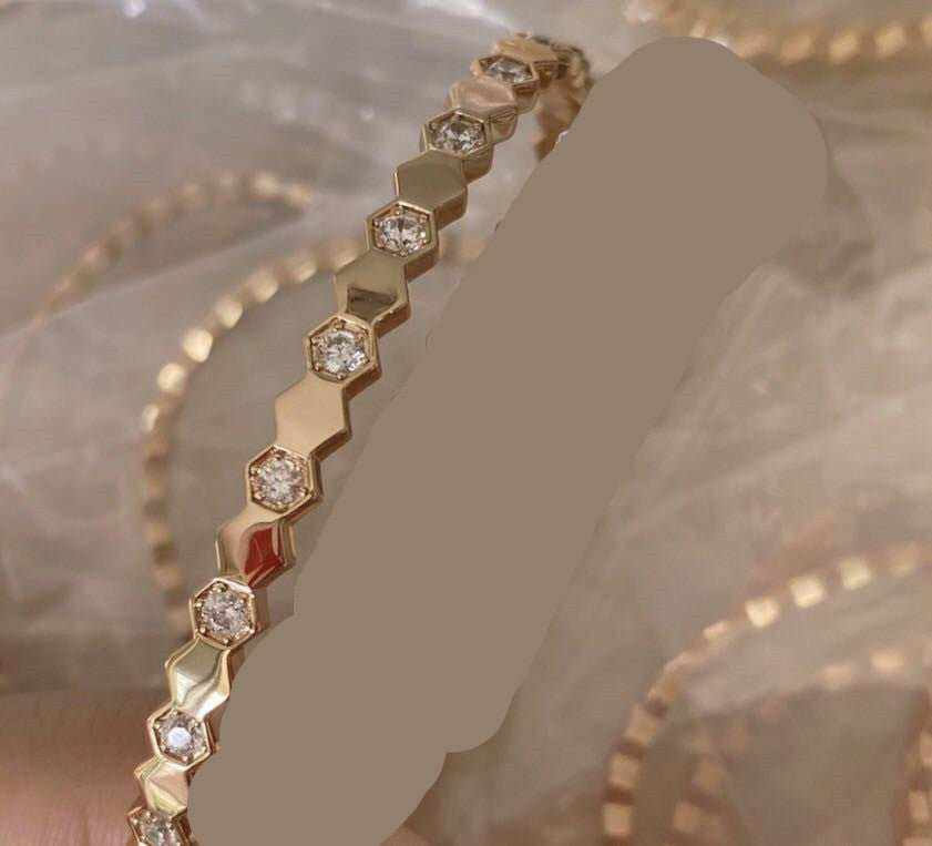 Sterling Silver Honeycomb Bracelet in gold electroplated metal with alternating hexagonal links and embedded clear stones