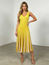 Chic Commuter Long Dress in yellow with sleeveless V-neck, vertical stripes, pleated skirt, and high-waist fit for elegant style