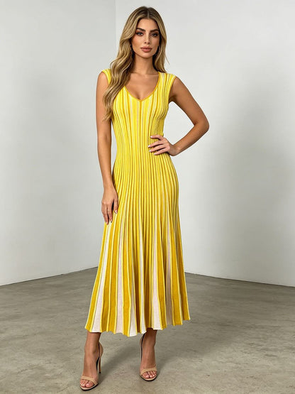 Chic Commuter Long Dress in yellow with sleeveless V-neck, vertical stripes, high-waist fit, and pleated long skirt