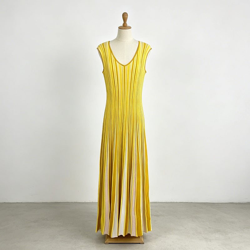 Chic Commuter Long Dress in yellow with vertical stripes, sleeveless V-neck, pleated long skirt, and polyester-cotton blend