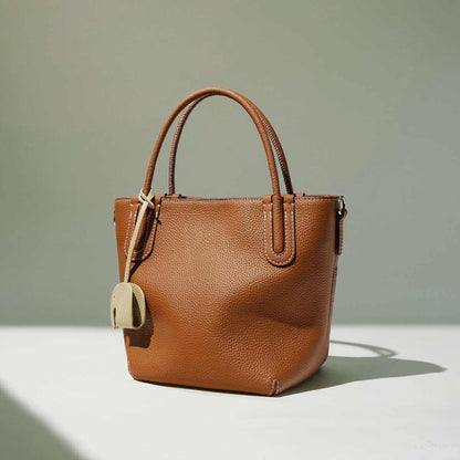 Genuine leather crossbody handbag with sleek bucket silhouette in black