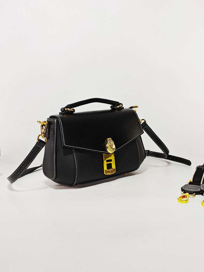 Luxury Anti-Theft Fingerprint Lock Shoulder Bag in black leather with white stitching, gold clasp, top handle and strap
