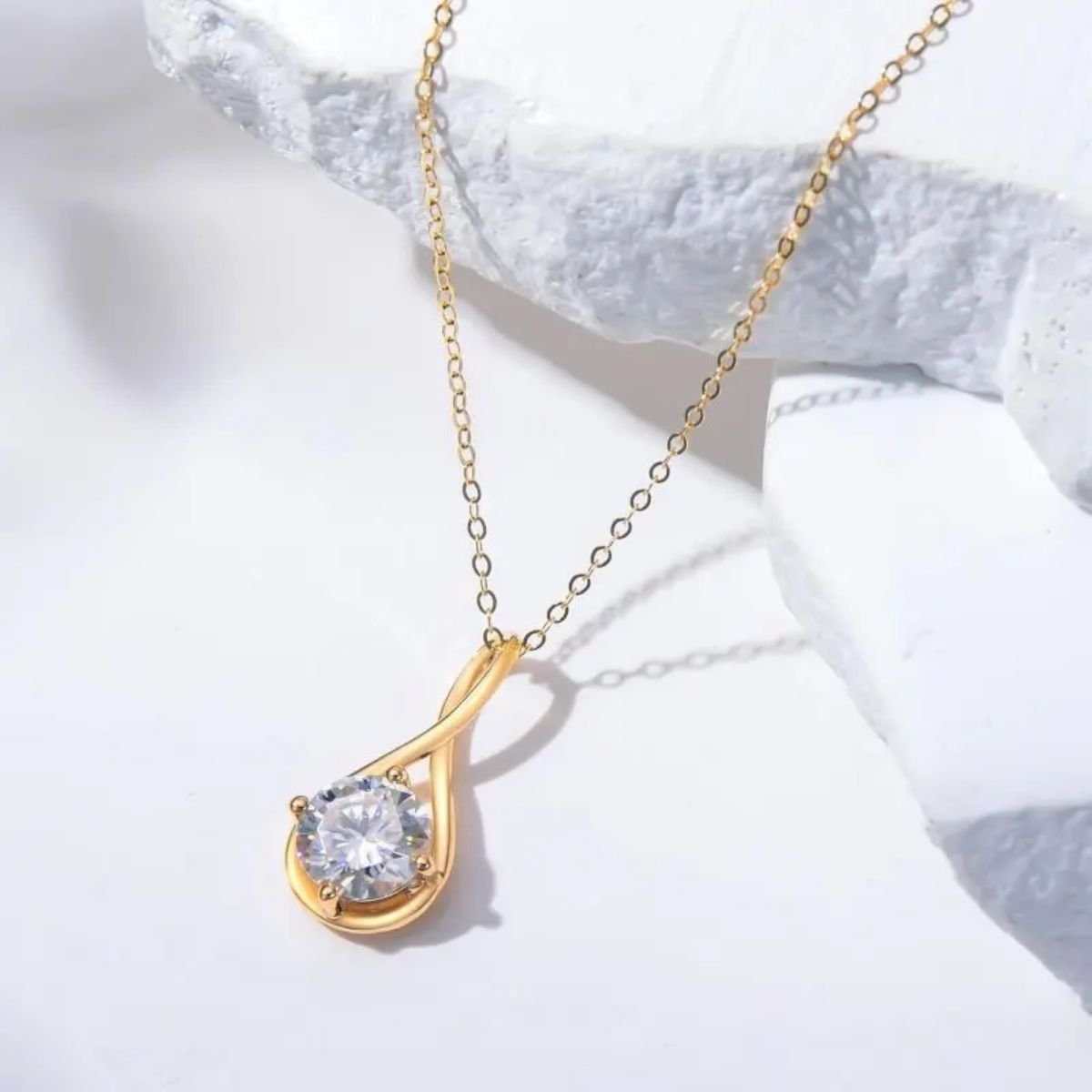 Brilliant round moissanite pendant in 14K gold on delicate chain