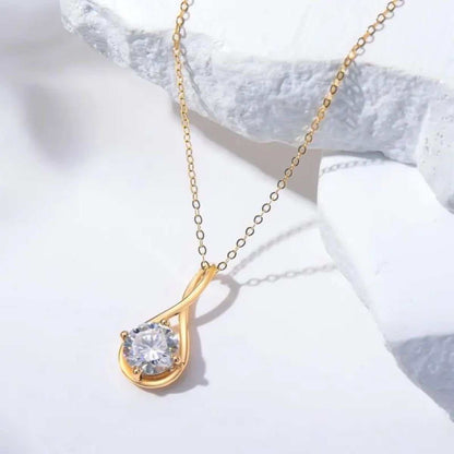 Brilliant round moissanite pendant in 14K gold on delicate chain