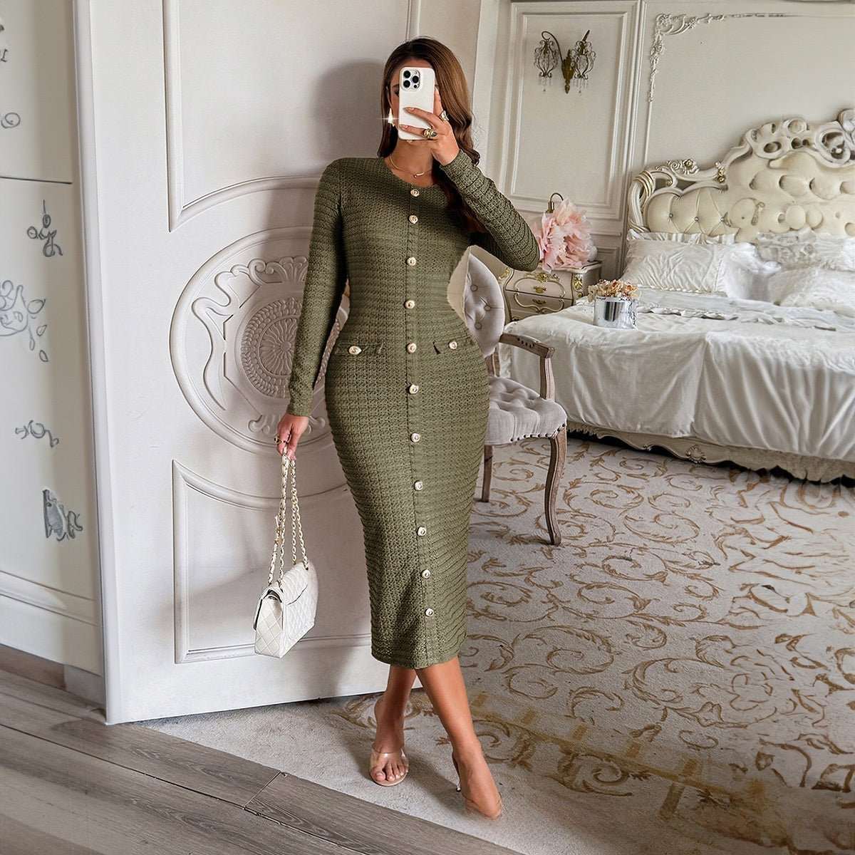 Woman wearing structured knit long-sleeve sweater dress in black