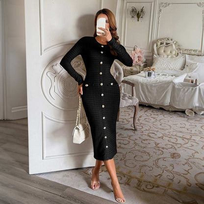 Woman wearing structured knit long-sleeve sweater dress in black