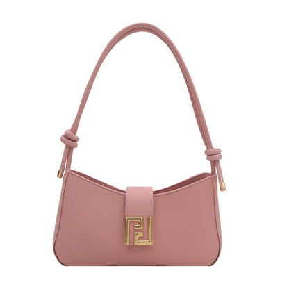 Versatile women’s handbag in black synthetic leather, adjustable strap and secure zipper closure displayed