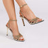 Elegant high-heel sandals with rhinestone accents and adjustable buckle