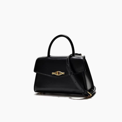 Vintage Metal Buckle black synthetic leather handbag with structured shape, top handle, flap closure, and shoulder strap