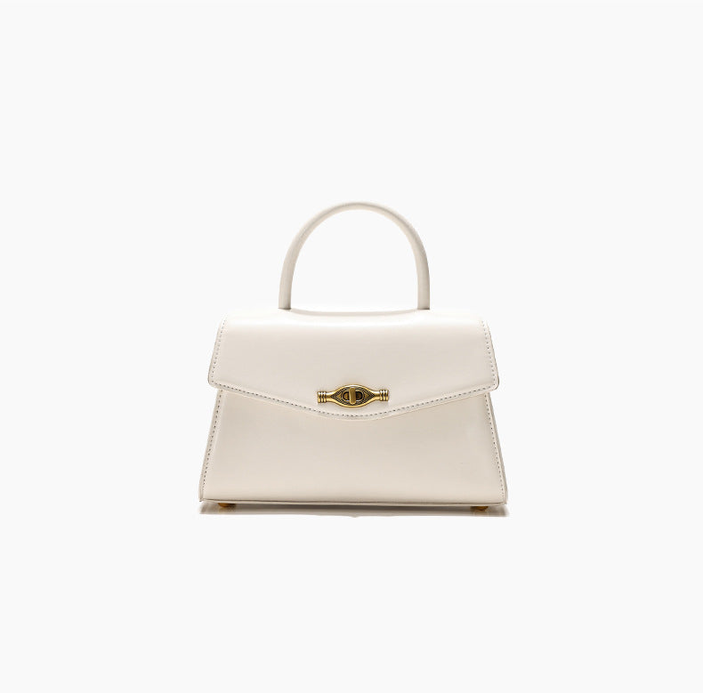 Vintage Metal Buckle handbag in cream white synthetic leather with a structured silhouette and top handle