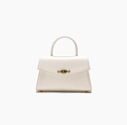Vintage Metal Buckle handbag in cream white synthetic leather with a structured silhouette and top handle