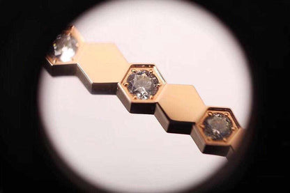 Sterling Silver Honeycomb Bracelet close-up showing gold hexagonal links with embedded clear gemstones in a honeycomb pattern