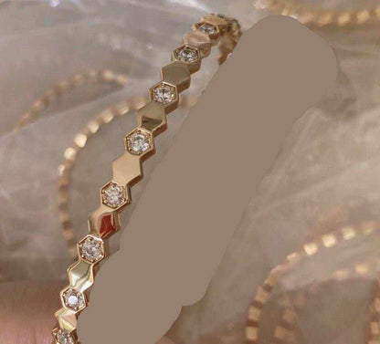 Sterling Silver Honeycomb Bracelet in gold electroplated metal with alternating hexagonal links and embedded clear stones
