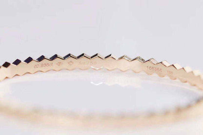 Sterling Silver Honeycomb Bracelet with a zigzag honeycomb pattern in gold electroplated metal, showcasing delicate engraved markings