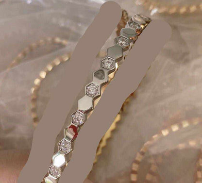 Sterling Silver Honeycomb Bracelet featuring hexagonal segments with embedded sparkling stones and polished silver finish
